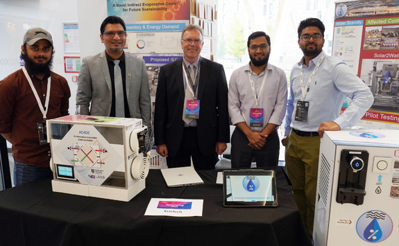 Image Caption – Dr Tim Hammond with the founding team of Northumbria University’s EcoTech69, showcasing their innovative ‘Solar2Water’ and ‘OptimumAirCon’ devices. From L-R: Muhammad Mehroz, Dr. Muhammad Wakil Shahzad, Dr Tim Hammond, Muhammad Ahmad Jamil, Mohammed Sanjid Thavalengal